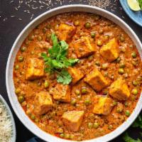 Muttar Paneer Curry · Homemade cheese and garden peas cooked in onion, tomato and creamy curry sauce.