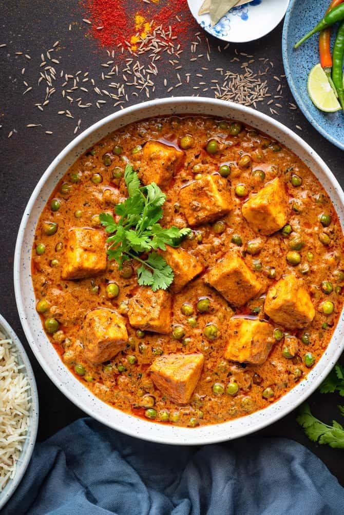 Matar Paneer · Gluten friendly and dairy-free. Homemade cottage cheese cooked in creamy tomato sauce and Indian spices.