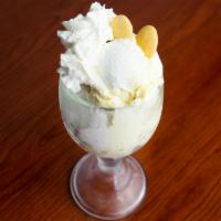 Down Home Banana Pudding · Rich and creamy banana pudding with slices of fresh bananas and vanilla wafers, topped with ...