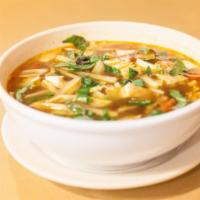 Tom Yum Soup · Spicy Thai soup with tamarind-based broth, lemongrass, king oyster mushroom, tofu, cabbage, ...
