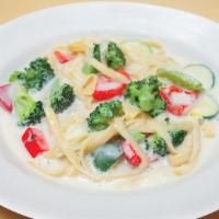 Fettuccine Alfredo · Fettuccine, zucchini, broccoli, and red bell pepper in the creamy white sauce, served with t...