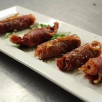 Fried Prosciutto Poppers · 5 long hot peppers and sharp provolone wrapped in prosciutto.