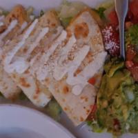Grilled Chicken Quesadilla · Flour tortilla filled with Monterrey Jack and Muenster cheese mix. Served with guacamole, pi...