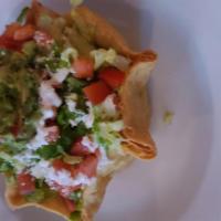 Meatless Taco Salad · Deep-fried flour tortilla wrap filled with beans, onions and cheese. Served with rice, beans...