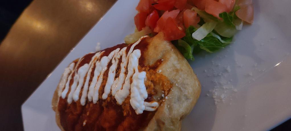 Mexican Shrimp Chimichanga · Deep-fried flour tortilla wrap filled with beans, onions ad cheese served with rice and beans. 