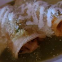 Enchiladas Verdes · Stuffed with your choice of shredded chicken or cheese and topped with green tomatillo sauce...
