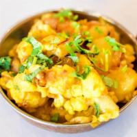 Allo Gobi · Fresh cauliflower and potatoes mixed with ginger and garlic prepared in our special blend of...