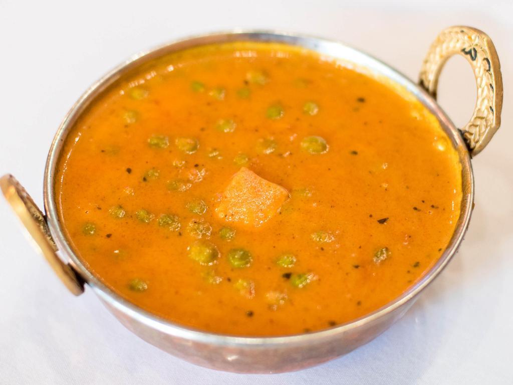 Mattar Paneer · Green peas and chunks of our homemade cheese (paneer) cooked in a light delicate Indian sauce.