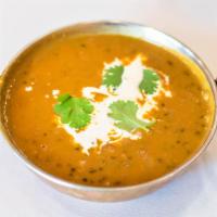 Dal Makhani · Black lentils cooked in a creamy sauce with tomatoes, ginger, garlic and spices of India.