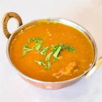 Chicken Curry · Boneless pieces of chicken cooked to perfection in a gravy with ginger, garlic and fresh tom...