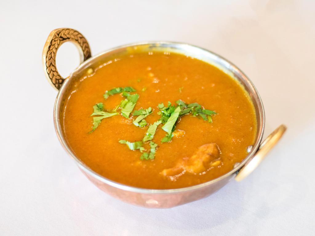 Chicken Curry · Boneless pieces of chicken cooked to perfection in a gravy with ginger, garlic and fresh tomatoes.