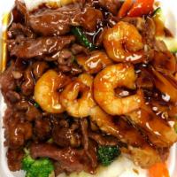 Combination Teriyaki(Plate) · Chicken,Beef and Shrimp. Served with veggies on steamed rice glazed with teriyaki sauce.