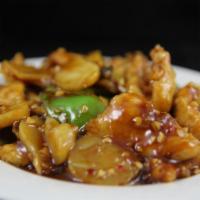 4. Chicken in Garlic Sauce · White meat chicken, green bell peppers, water chestnuts, mushrooms and bamboo shoots stir-fr...