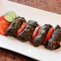 Dolmeh · Deliciously stuffed baby grape leaves with rice, onions, herbs and spices, steam cooked to i...