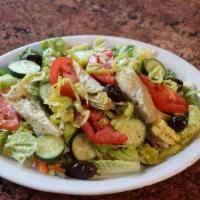House Salad · This salad has been uniquely paired with heart of romaine, artichoke hearts, pepproncinis, t...