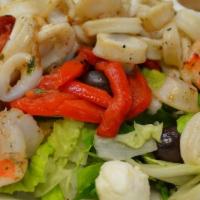 Grilled Shrimp and Calamari Salad · Marinated grilled shrimp and calamari, fresh mozzarella, roasted peppers, olives and balsami...