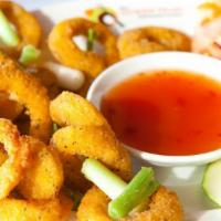 7. Fried Calamari · Lightly battered calamari rings fried to a golden brown and served with sweet chili sauce.