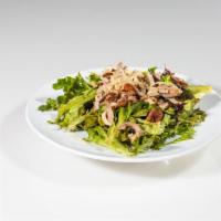 Roasted Duck Salad · Boneless roasted duck, spring mix, walnuts and fried leeks, lime hoisin dressing.