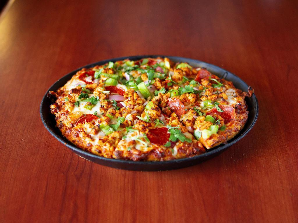 East Meet West Pizza · Chicken tikka with pepperoni. Masala marinated chicken, pepperoni, red onions, bell peppers, fresh cilantro with mozzarella cheese and creamy curry sauce.