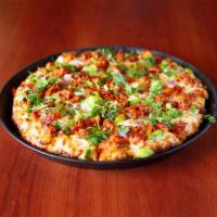 Tandoori Chicken Pizza · Tandoori chicken. Tandoori marinated chicken, red onions, bell peppers, fresh cilantro with ...