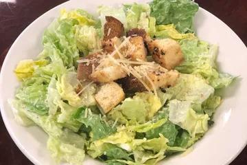 Caesar Salad · Romaine, Parmesan and homemade croutons.