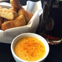 Four Peaks Beer Cheese · Four Peaks Kilt Lifter, cheddar, Swiss, garlic, Texas Pete's hot sauce, pepper and paprika.