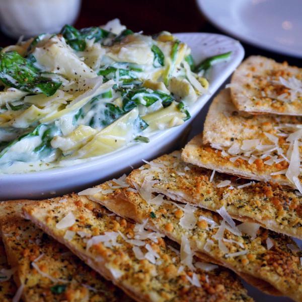 Artichoke Spinach Dip · Served with garlic buttered pizza bread. Gluten free option available for an additional charge.