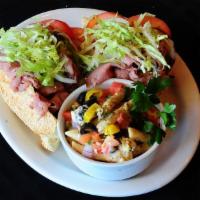 3. Piled High Roast Beef Sub Sandwich · Warm roast beef, lettuce, tomatoes, onions, mayonnaise and Street's Italian dressing.