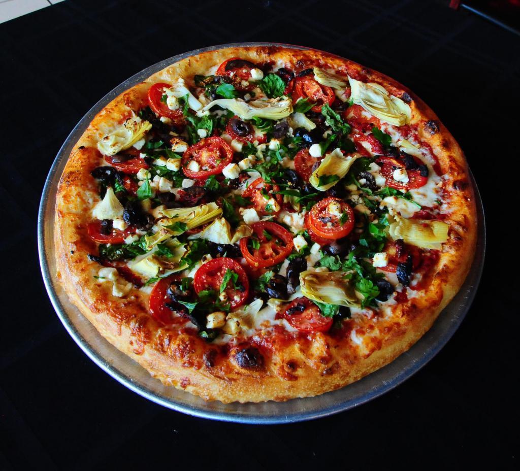Mediterranean Pizza · Spinach, Roma tomatoes, red onions, sun-dried tomatoes, artichokes, Kalamata olives and feta cheese.