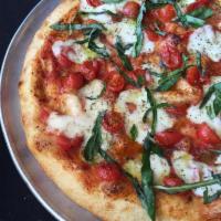 Neapolitan Pizza · Light tomato sauce, Italian cherry tomatoes, fresh mozzarella, fresh basil, Tuscan extra vir...