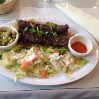 Shami Kabob · 2 skewers of the seasoned ground beef. All kabobs served with rice, salad and shor nakhod. A...
