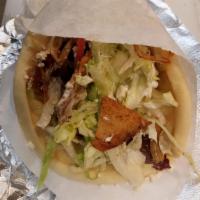 Chicken Gyro Sandwich · Chicken Gyro, seared on a gas flame, wrapped with lettuce, tomatoes, cucumbers, onions, feta...