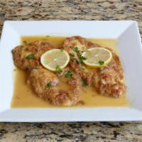 Chicken Francese · Dusted in flour, dipped in egg wash and sauteed with white wine, lemon and butter.