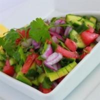 Salad Shirazi · Diced cucumbers, tomatoes and onions mixed with chopped parsley and crushed dried mint seaso...