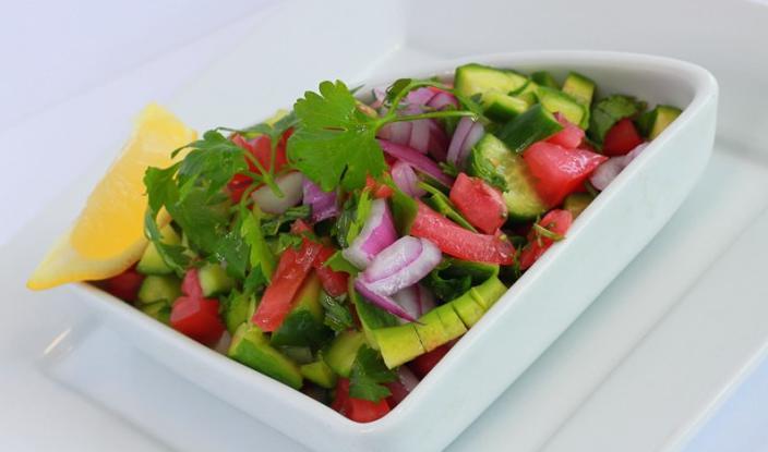 Salad Shirazi · Diced cucumbers, tomatoes and onions mixed with chopped parsley and crushed dried mint seasoned with lime dressing.