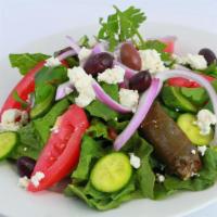 Greek Salad · Mixed greens, cucumbers, onions and tomatoes, topped with fresh feta cheese, black olives, p...
