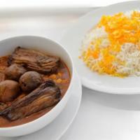 Khouresh Bademjan · Tomato based stew with yellow split peas, eggplant and tender beef.