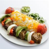 Shish Kabob · Chunks of marinated lamb skewered with tomatoes, onions and peppers broiled to perfection.