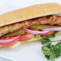 Ground Chicken Kobideh Sandwich · Seasoned ground chicken served with lettuce, tomatoes, pickles, onions and mayonnaise on a h...