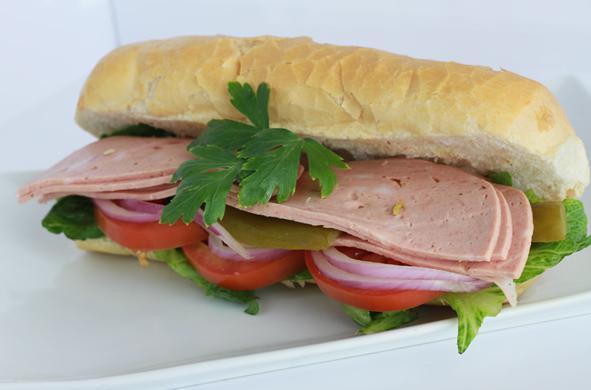 Kalbas Sandwich · Mortadela meat with pistachio and garlic flavor served with lettuce, tomatoes, pickles, onions and mayonnaise on a hoagie sub.