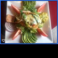 Salmon Relleno · Fresh butterfly-cut grilled salmon with spinach, onions, peppers, mushrooms and melted chees...