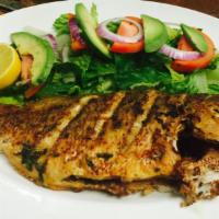Pescado Frito · Fresh fried red snapper marinated Mi Rancho style. Served with fresh avocado salad, rice and...