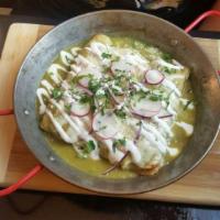 Kermes Enchiladas · Pulled chicken rolled in corn tortillas, queso fresco and crema and topped with lettuce.