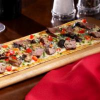 Steak and Wild Mushroom Flatbread · Crisp flatbread topped with grilled beef tenderloin, melted havarti cheese, crumbled bleu ch...