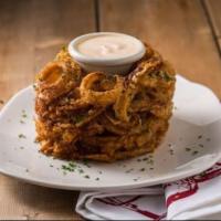 Onion Loaf · Giant hand-cut Spanish onions, breaded, deep-fried and served with Tony Roma's original barb...