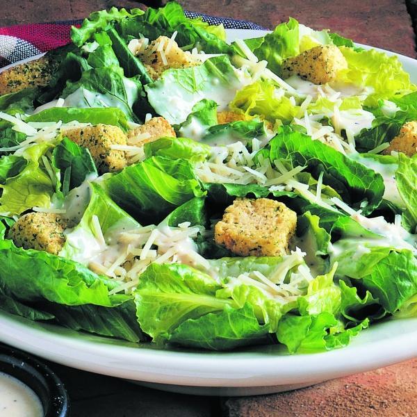 Caesar Salad · Fresh romaine lettuce with Caesar dressing topped with shaved Asiago cheese and croutons. Add grilled or crispy chicken or grilled salmon for an additional charge.