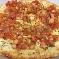 Focaccia al Pomodoro · Thin pizza bread with fresh tomatoes, basil, and olive oil.
