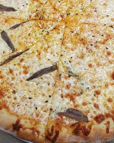 Pizza Romana · Anchovies, oregano, & olive oil
