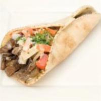 Beef Shawarma Wrap · Delicious marinated beef with lettuce, tomatoes, cilantro, onion and our special house sauce. 