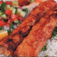 Chicken Lule Plate · Seasoned ground chicken. Served with hummus, grilled green pepper and tomato, choice of rice...